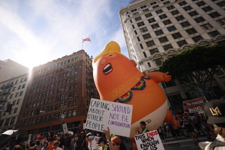 A giant inflatable Donald Trump balloon is seen while protestors march during the "No Kings" national day of protest in Los Angeles on March 28, 2026. 
