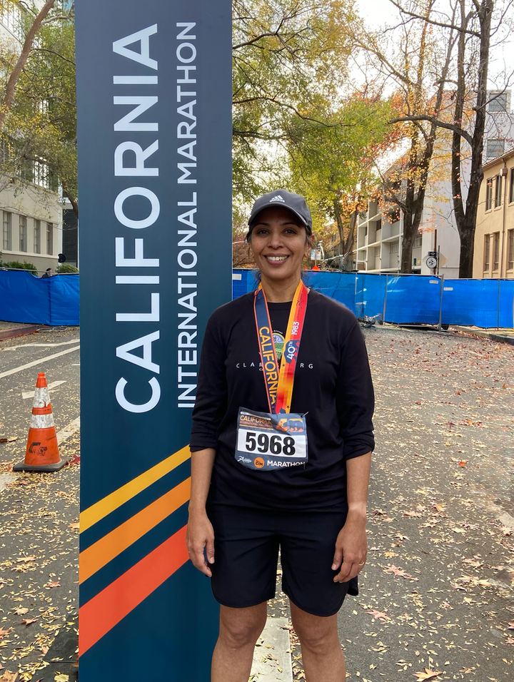 The author after running her 26th marathon