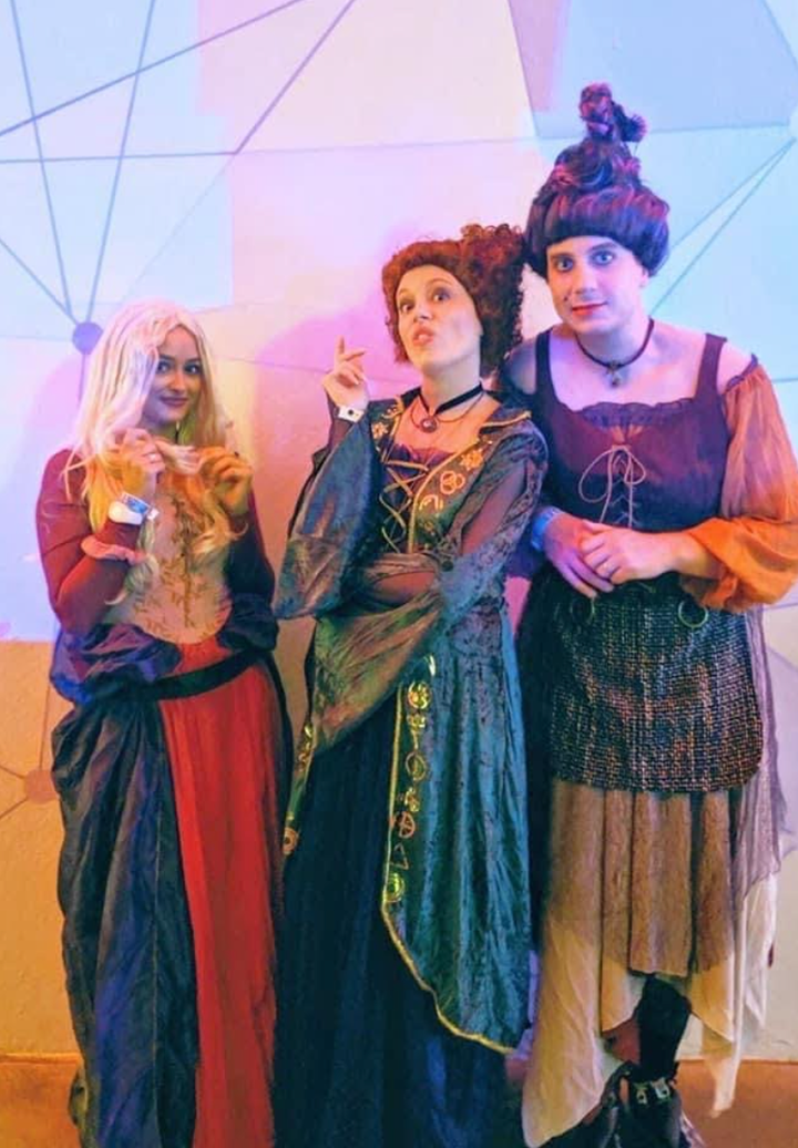The author (middle) with her husband (right) and a friend at Disney on Halloween.