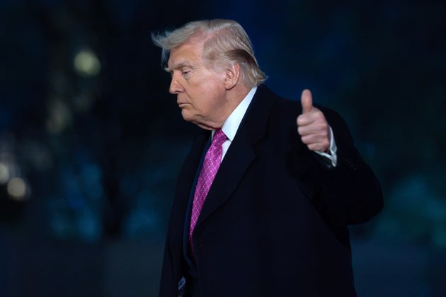 President Donald Trump waves to the media as he walks on the South Lawn upon his arrival to the White House, Sunday, March 29, 2026, in Washington.