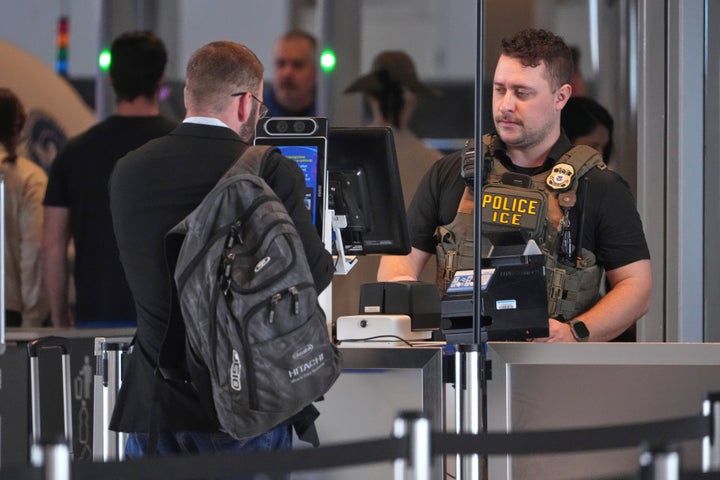 An ICE officer mans a TSA checkpoint at Pittsburgh International Airport on March 26.