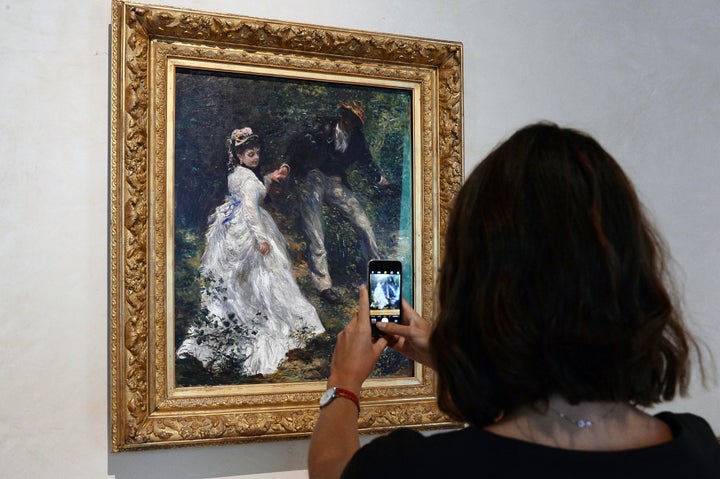 A patron views the Renoir exhibit at Magnani Rocca Foundation on September 13, 2024 in Parma, Italy. This specific portray, Pierre-Auguste Renoir's “La Promenade," was not stolen during the recent break-in at the private museum. (Photo by Roberto Serra - Iguana Press/Getty Images)