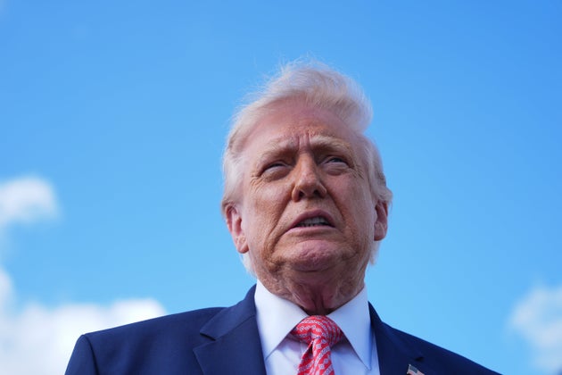 President Donald Trump speaks to reporters after stepping off Air Force One, Friday, March 27, 2026, at Miami International Airport in Miami.