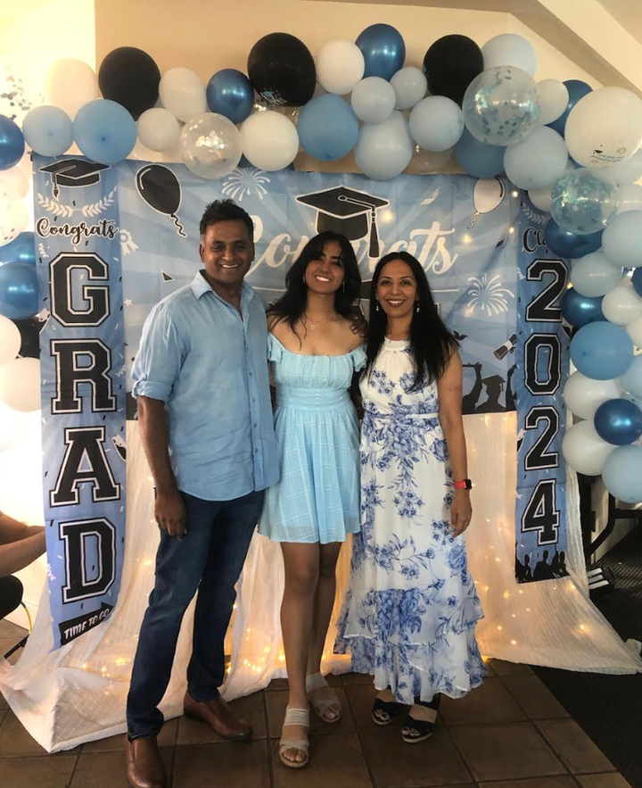 The author (right) with her husband and daughter at her daughter's high school graduation