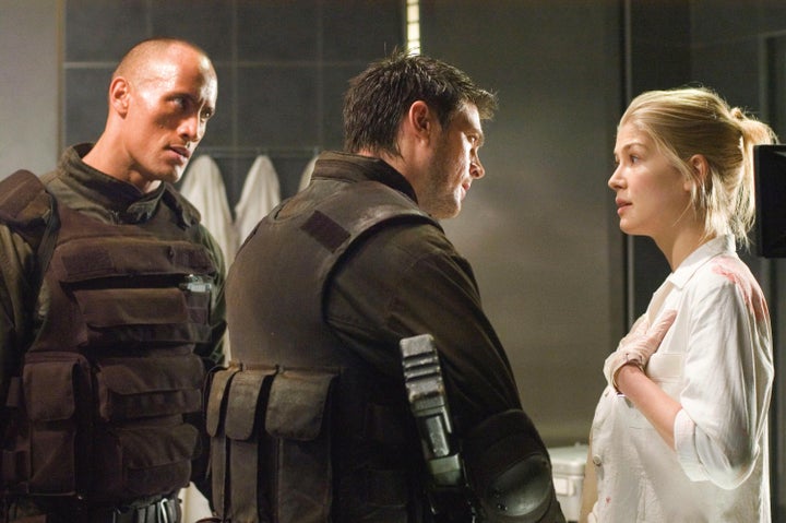 Dwayne "The Rock" Johnson and Rosamund Pike shared the screen in the 2005 movie adaptation of the video game Doom