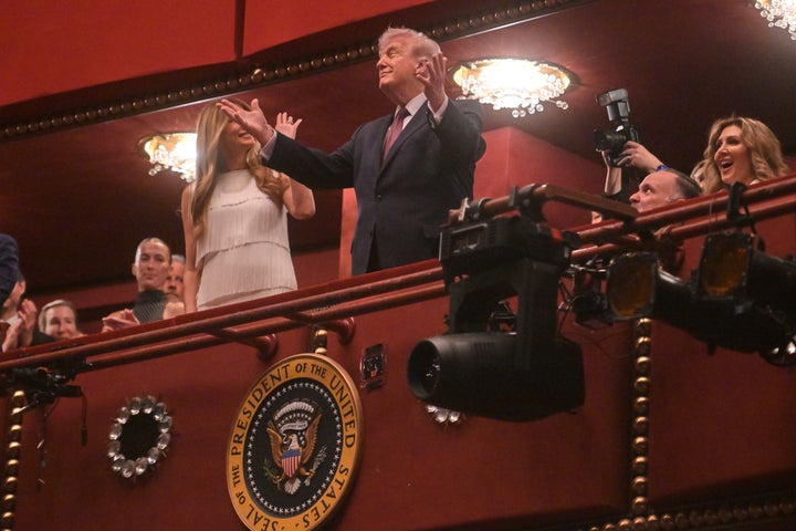 President Donald Trump and first lady Melania Trump arrive for the opening night performance of the musical "Chicago" at the John F. Kennedy Center for the Performing Arts in Washington on Tuesday.