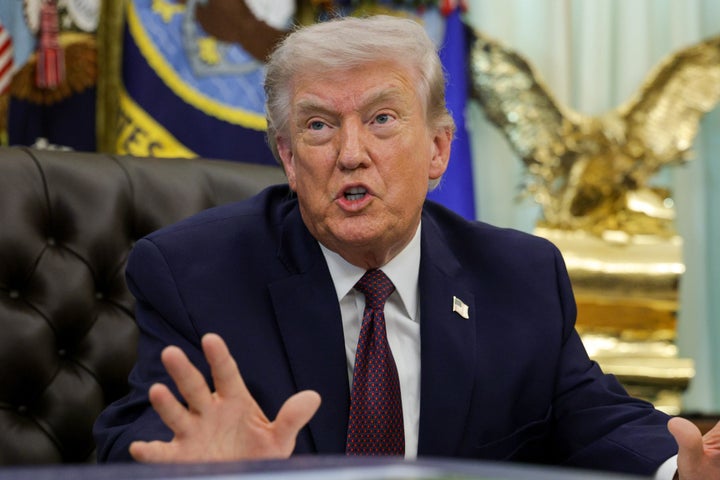 President Donald Trump answers questions after signing an executive order to limit mail-in voting in the Oval Office of the White House on March 31, 2026 in Washington, DC. (Photo by Alex Wong/Getty Images)