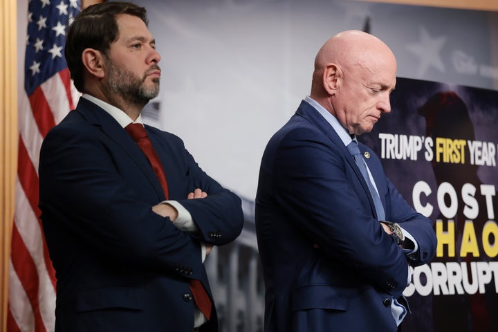 Democratic Sens. Ruben Gallego and Mark Kelly of Arizona listen during a news conference at the U.S. Capitol Building on Feb. 24, 2026, in Washington, D.C. 