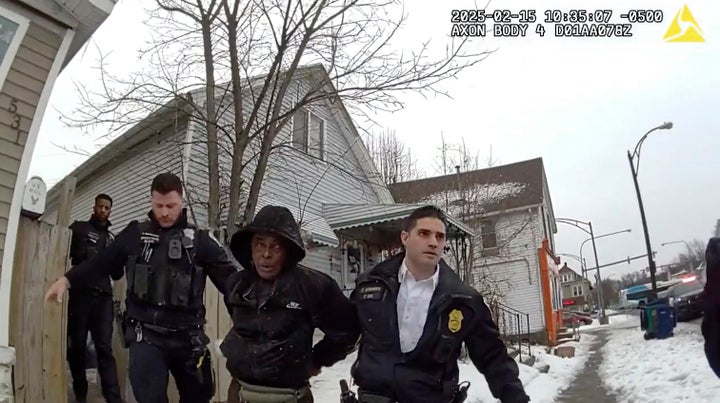 Nurul Amin Shah Alam, center, is seen in body camera footage being led by Buffalo Police officers on Feb. 15 in Buffalo, N.Y.