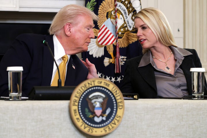 Trump speaks with then-Attorney General Pam Bondi as he delivers an announcement on his Homeland Security Task Force in October 2025.
