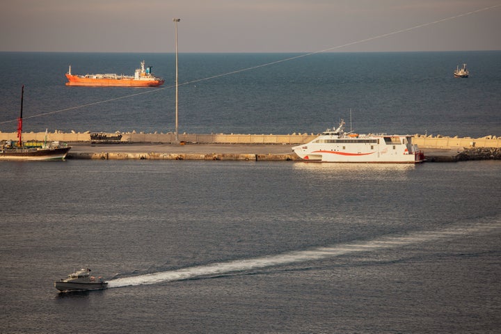 MUSCAT, OMAN - MARCH 30: A police speed boat patrols the port as oil tankers and high speed crafts sit anchored at Muscat Anchorage near the Strait of Hormuz on March 30, 2026 in Muscat, Oman.