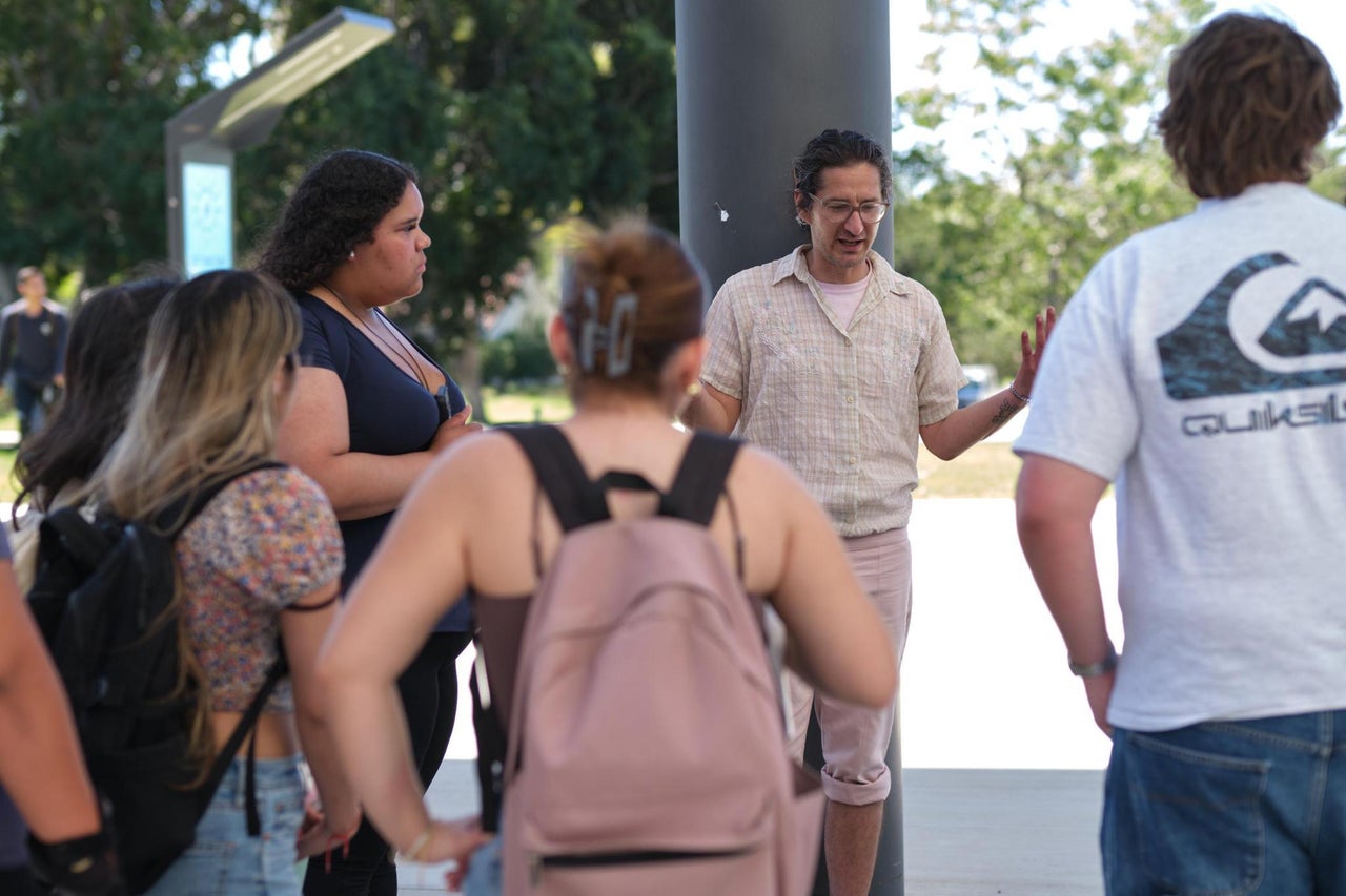 Caravello's former students describe him as an experienced organizer and mentor figure.