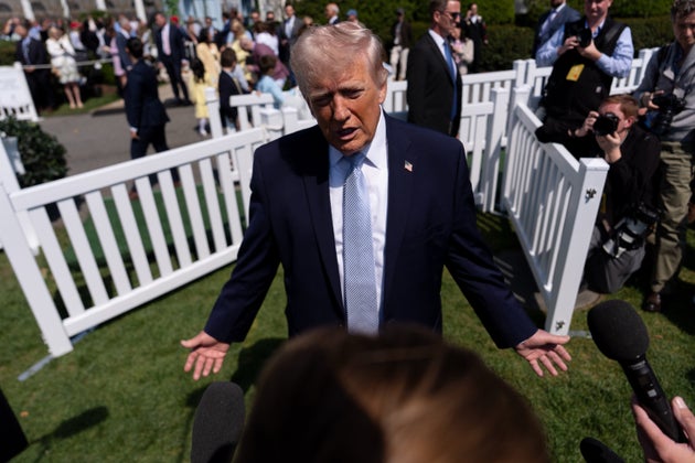 Donald Trump speaks with reporters during the White House Easter Egg Roll on the South Lawn of the White House.