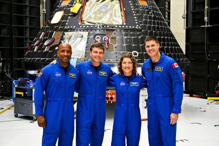 The crew of Artemis II pose with the crew module in 2023. (L-R) U.S. astronauts Victor Glover, pilot; Reid Wiseman, commander; Christina Hammock Koch, mission specialist; and Canadian astronaut Jeremy Hansen.