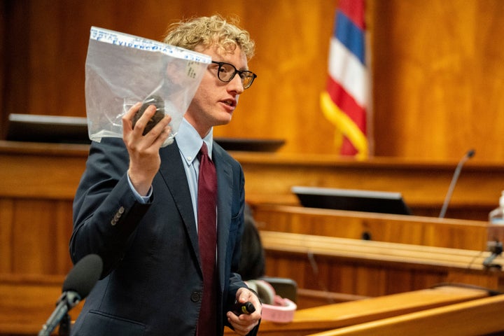 Deputy Prosecutor Joel Garner holds a rock as evidence while presenting closing arguments during the attempted murder trial of Gerhardt Konig Tuesday in Honolulu.