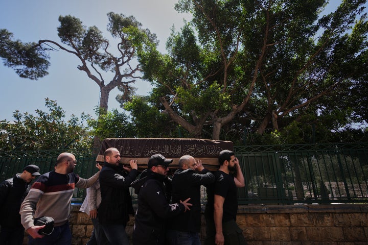 Mourners carry the coffin of Mohammad Zein al-Abedin Shehab, who was killed in an Israeli airstrike a day earlier, during his funeral procession in Beirut, Lebanon, Thursday, April 9, 2026. (AP Photo/Hassan Ammar)