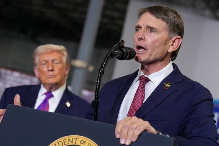 Republican congressional candidate for Kentucky, Ed Gallrein, speaks as U.S. President Donald Trump looks during an event at Verst Logistics on March 11, 2026, in Hebron, Kentucky. Verst Logistics handles packaging, shrink sleeve labeling, and transportation management for various brands. 