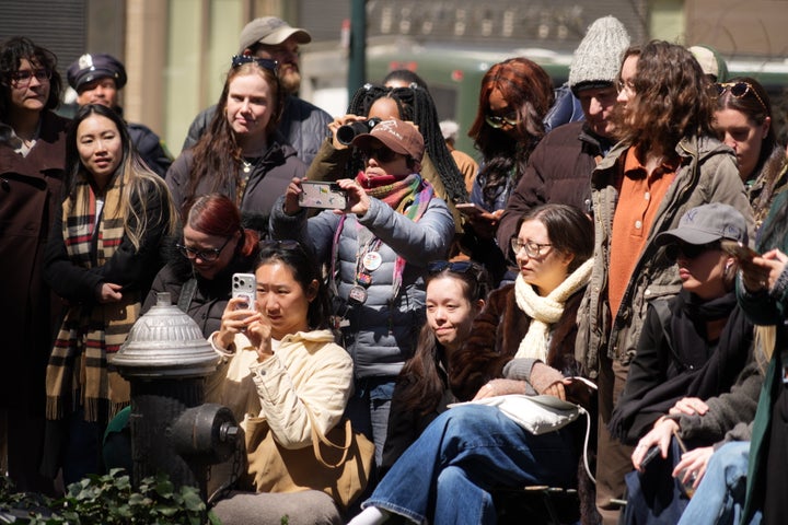 Visitors take snaps of the viral bird as it pauses along its spring migration route at Bryant Park on Wednesday.