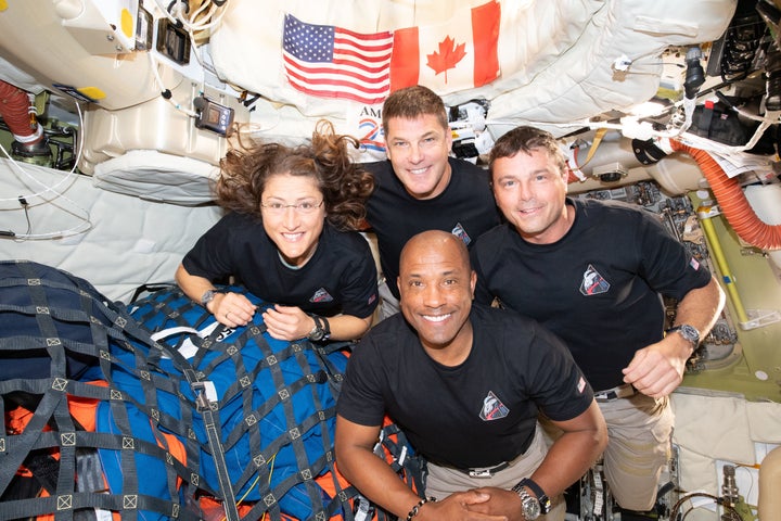In this image provided by NASA, the Artemis II crew, clockwise from left, Mission Specialist Christina Koch, Mission Specialist Jeremy Hansen, Commander Reid Wiseman, and Pilot Victor Glover, pause for a group photo inside the Orion spacecraft on their way home on April 7, 2026.
