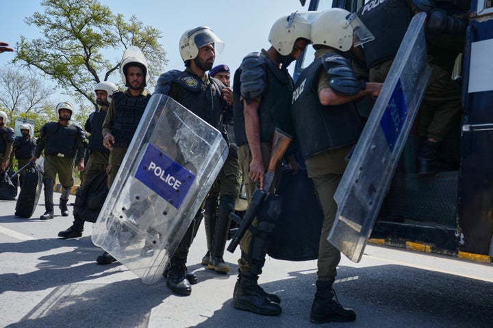 Police officers get into a bus for their deployment in Islamabad, Pakistan, to ensure security ahead of possible negotiations between Iran and the United States, on April 10, 2026.