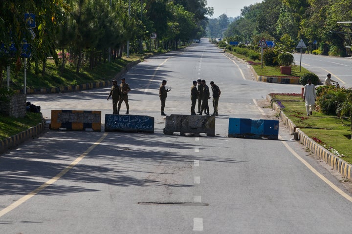 Police officer stand guard at a barricaded road to ensure security ahead of the United States and Iran possible negotiations in Pakistani capital, in Islamabad, Pakistan, on April 10, 2026.