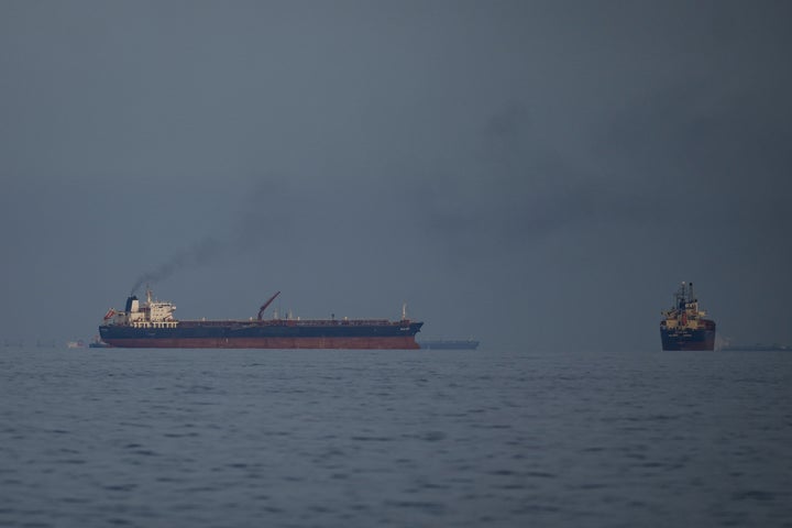 Oil tankers and cargo ships line up in the Strait of Hormuz as seen from Khor Fakkan, United Arab Emirates, Wednesday, March 11, 2026. (AP Photo/Altaf Qadri)