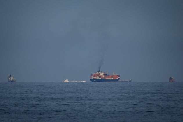 Oil tankers and cargo ships line up in the Strait of Hormuz.