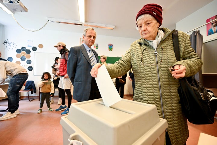 A woman votes at a polling station during the Hungarian parliamentary elections on Sunday, April 12, 2026 in Budapest, Hungary. (AP Photo/Denes Erdos)