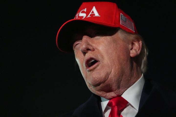 President Donald Trump speaks with reporters at Joint Base Andrews, Maryland, on Sunday, after he returned from Miami. Trump said he's "not a fan" of Pope Leo.