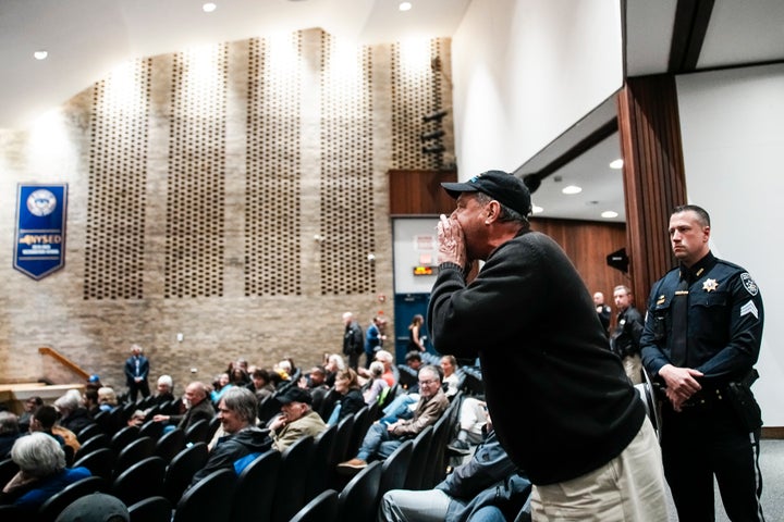A man heckles Rep. Mike Lawler (R-N.Y.) during a town hall on Sunday in Mahopac, New York.