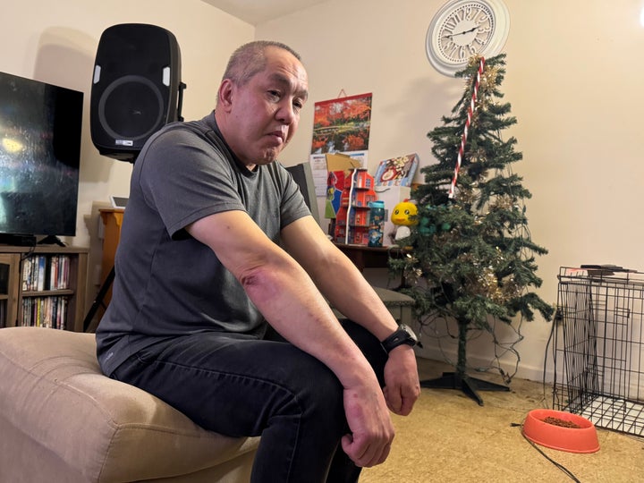 Chongly "Scott" Thao, a U.S. citizen, sits for a photo at his home Jan. 19, 2026, in St. Paul, Minn., the day after federal agents broke open his door and detained him without a warrant. (AP Photo/Jack Brook, file)