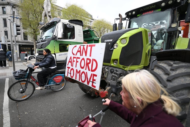 People pass trucks and tractors as fuel protesters block O'Connell Street in Dublin, Ireland, on April 11, 2026. (Photo: Charles McQuillan/Getty Images)