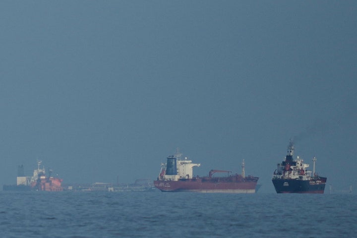 FILE - Oil tankers and cargo ships line up in the Strait of Hormuz as seen from Khor Fakkan, United Arab Emirates, Wednesday, March 11, 2026. (AP Photo/Altaf Qadri,File)