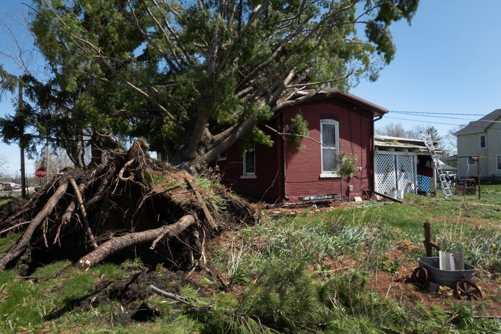 Residents continue to clean up following yesterday's tornado on April 18, 2026 in Lena, Illinois. (Photo by Scott Olson/Getty Images)