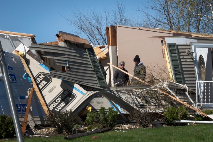 People continue to clean up following yesterday's tornado on April 18, 2026 in Lena, Illinois. (Photo by Scott Olson/Getty Images)