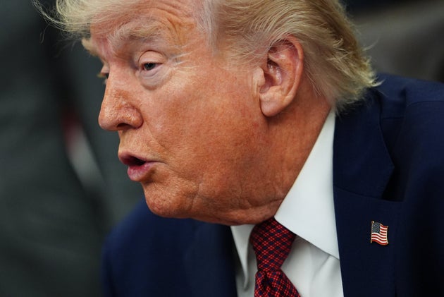 President Donald Trump listens to speeches before signing an executive order in the Oval Office of the White House, Saturday, April 18, 2026, in Washington.