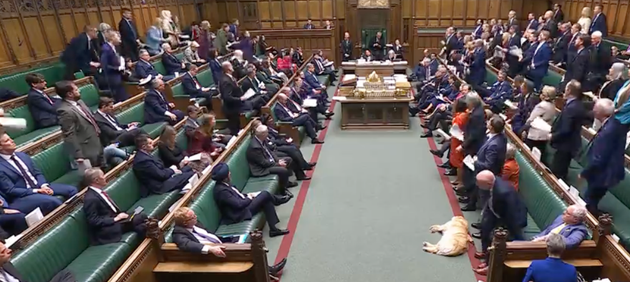 Empty benches behind the PM during his statement.