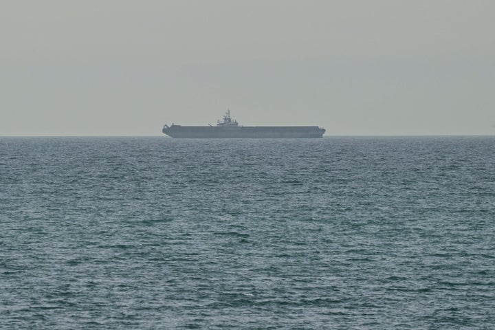 A ship is seen off the coast of Ras al-Khaimah, the day after the failure of US-Iran peace talks on April 13, 2026. The failure of US-Iran peace talks has left the US president with several unpalatable options, as analysts say his order to blockade the strategic Strait of Hormuz could further complicate his next move on April 12, 2026. Any hopes that the US vice president would emerge from the marathon day of negotiations with top Iranian officials with a deal to end a war that has rippled across the Middle East were dashed when he left hosts Pakistan emptyhanded. (Photo by AFP via Getty Images) / 