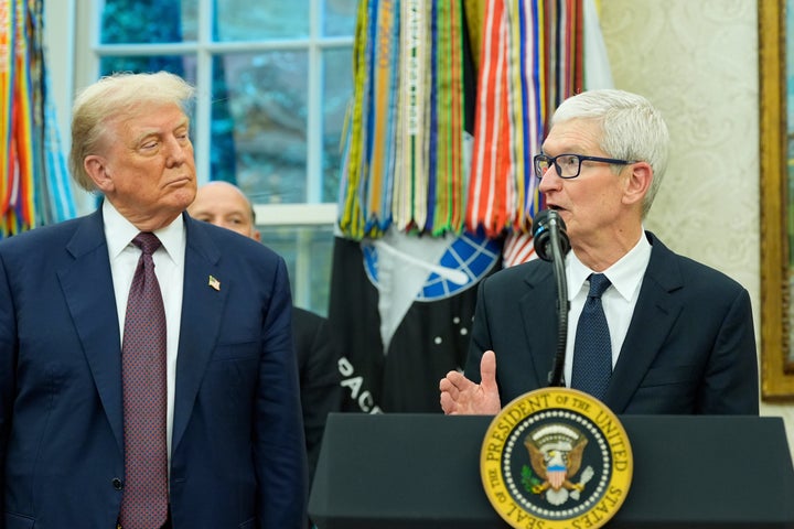 Apple CEO Tim Cook speaks, as President Donald Trump looks on, in the Oval Office in August 2025. Trump on Tuesday praised Cook as an "incredible guy" following Apple's announcement that he would soon step down as chief executive.