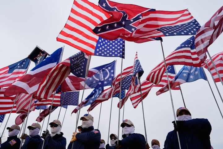 A member of the Patriot Front holds a Confederate flag on the National Mall in January, during the annual March for Life in Washington.