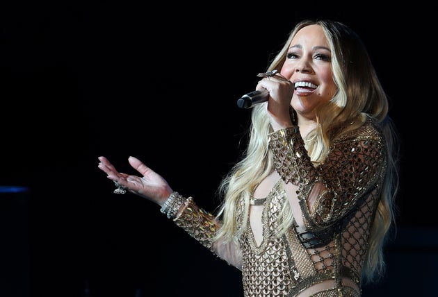 FILE - Mariah Carey performs during a concert in Dubai, United Arab Emirates, Oct. 20, 2019. A prosecutor on Monday, Aug. 29, 2022, announced a sprawling indictment targeting members of what she said is a violent street gang that has been targeting the Atlanta area homes of famous athletes, entertainers and others who flaunt expensive possessions on social media. Carey, is among celebrities who had their homes broken into, according to the indictment. (AP Photo/Kamran Jebreili, File)