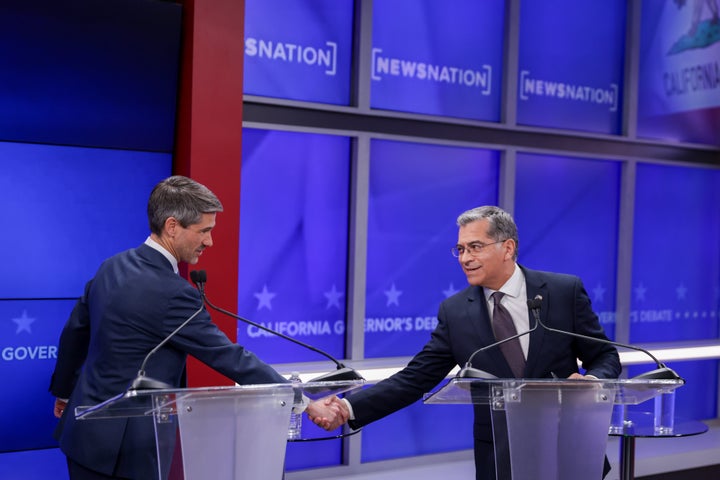 Matt Mahan, left, and Xavier Becerra, candidates in California's gubernatorial race, shake hands during a debate Wednesday, April 22, 2026, in San Francisco.