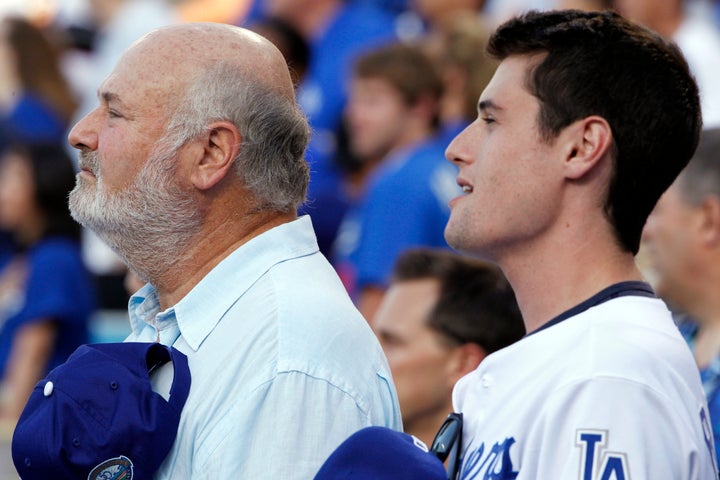 Rob Reiner and his son Jake attend a baseball game between the Los Angeles Dodgers and the Chicago Cubs at Dodger Stadium in Los Angeles in 2012.
