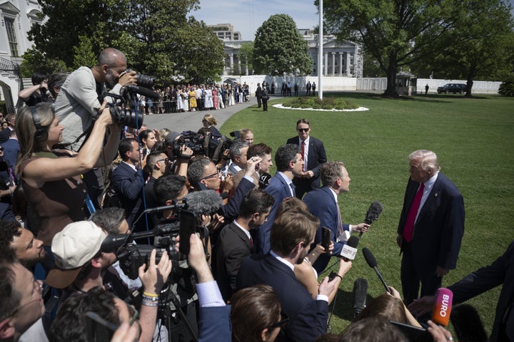 Trump speaks to a crowd of reporters in April.