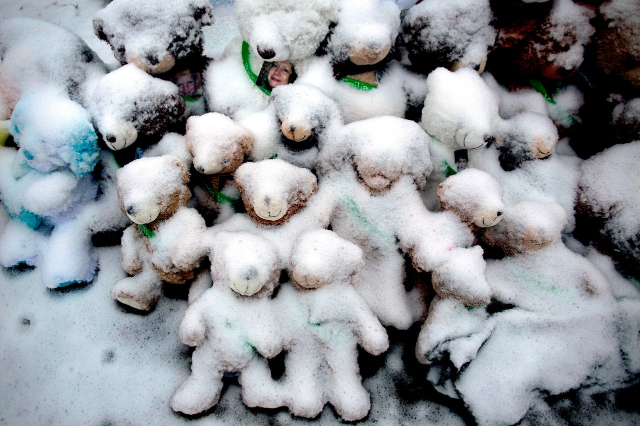 Snow-covered stuffed animals for victims of the Sandy Hook shooting at a memorial in Newtown, Connecticut, on Dec. 25, 2012.