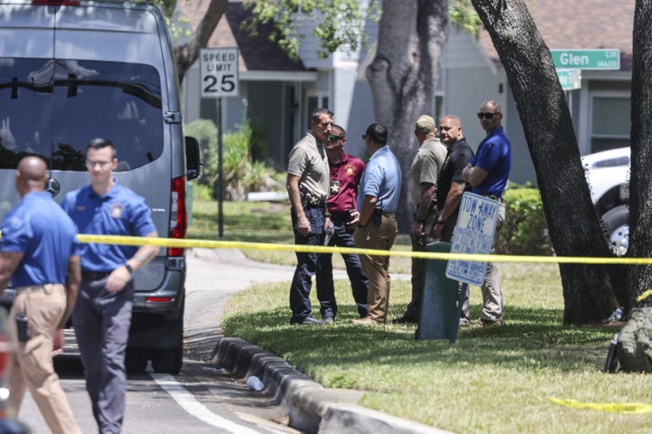 Detectives with the Hillsborough County Sheriff's Office join an investigation inside the Lake Forest subdivision of Tampa, Florida, on Friday, April 24, 2026, where authorities said a man was taken into custody after barricading himself inside a home, in connection to the search for two missing University of South Florida graduate students.