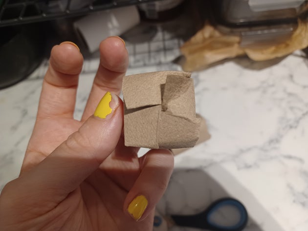 Folded toilet roll tube