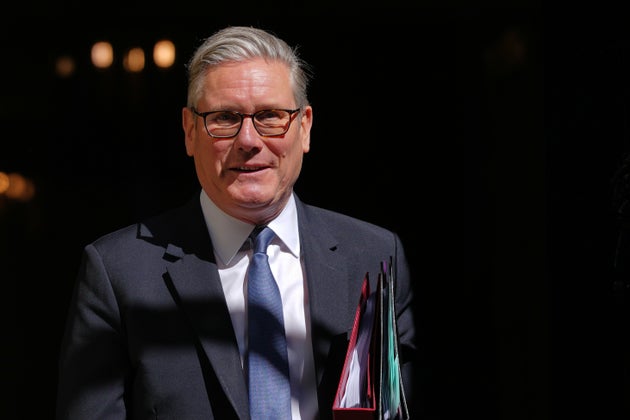 Britain's Prime Minister Keir Starmer leaves 10 Downing Street to attend the weekly session of Prime Minister's Questions in parliament in London, Wednesday, April 22, 2026. 