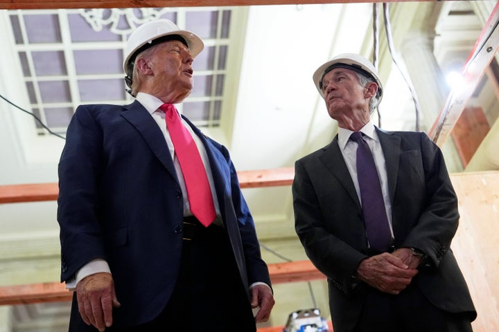 President Donald Trump, left, speaks with Federal Reserve Chairman Jerome Powell during a visit to the Federal Reserve, Thursday, July 24, 2025, in Washington. (AP Photo/Julia Demaree Nikhinson)