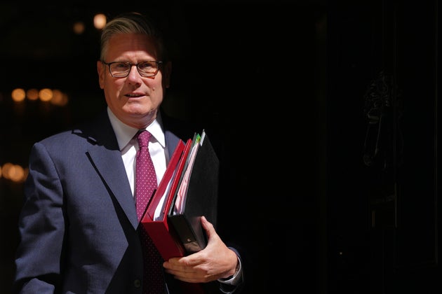 Britain's Prime Minister Keir Starmer leaves 10 Downing Street to attend the weekly session of Prime Minister's Questions in parliament in London, Wednesday, April 29, 2026. (AP Photo/Kirsty Wigglesworth)